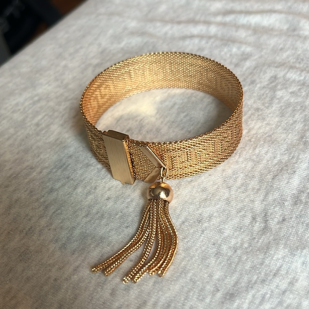 Vintage 1970s Greek key design gold tone articulated flat tassel bracelet